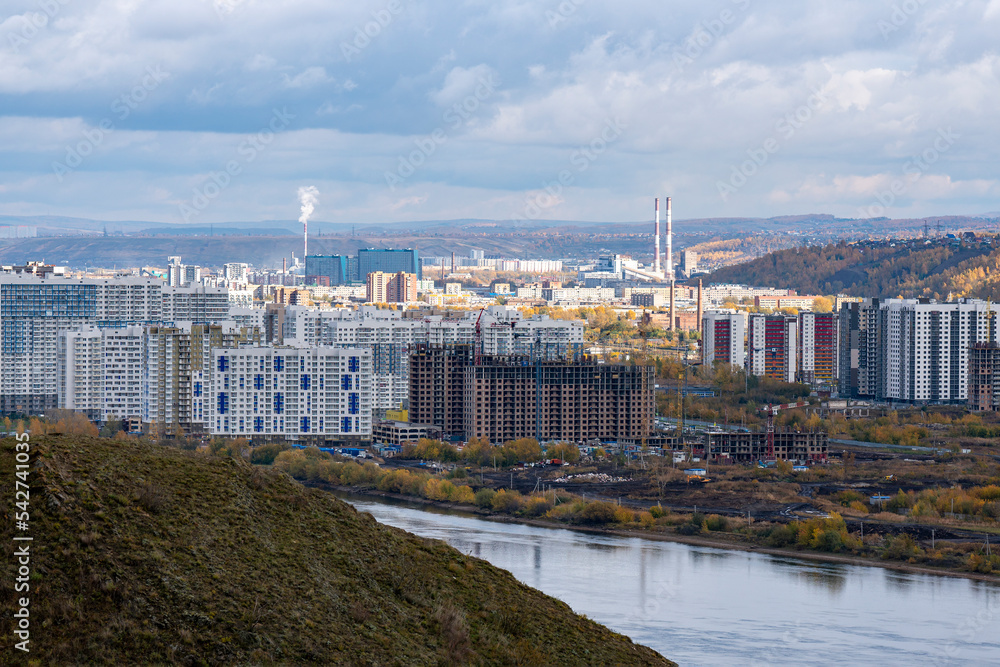 A modern industrial city on the banks of the river.