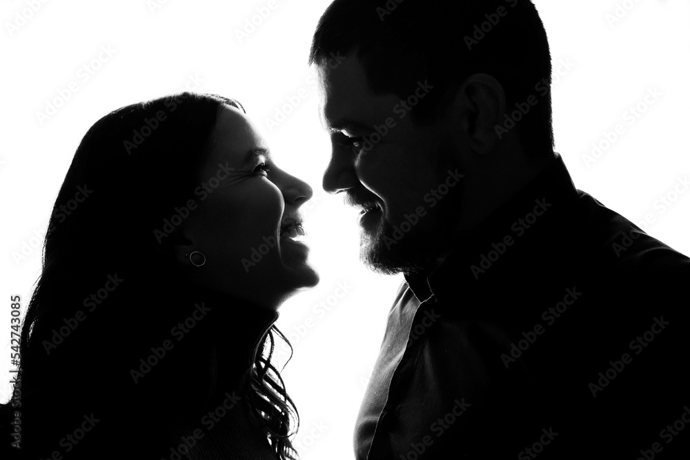 Silhouette a happy couple holding each other Silhouette a happy couple holding each other