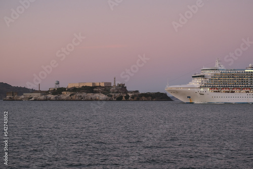 Princess cruiseship or cruise ship liner Ruby P in San Francisco port Bay terminal sail away cruising with Sausalito skyline twilight blue hour sunset sky Alcatraz Golden Gate sailing boats yachts photo