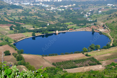 Fototapeta Naklejka Na Ścianę i Meble -  Scenic view of Mastani Talav or Lake From Dive Ghat, situated near Wadki village, The water reservoir was built around 1720, Pune, Maharashtra, India.