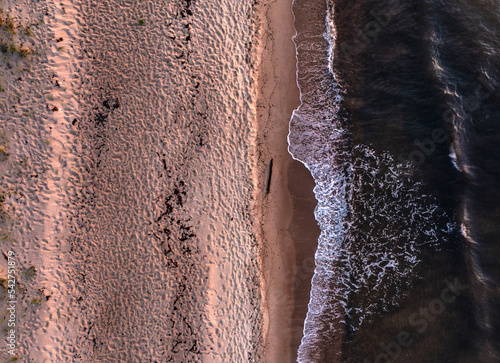Dramatic aerial shoot of Swedish beach with braking waves of the Baltic, micro four thirds Inspire 2 drone photo