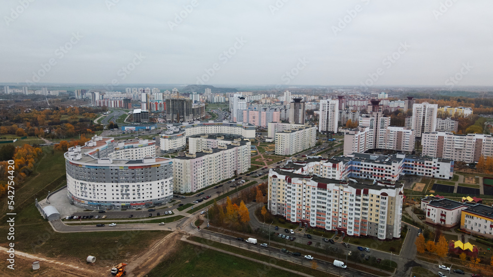 Multi-storey buildings with infrastructure. Densely populated urban area. Overcast weather. Autumn landscape. Aerial photography.