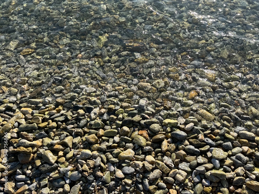 sea pebbles, transparent sea water with rocky bottom sea pebbles, transparent sea water with rocky bottom