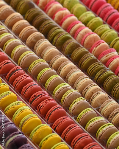 Assortment of mutiflavoured traditional french pastries macarons arranged in rows