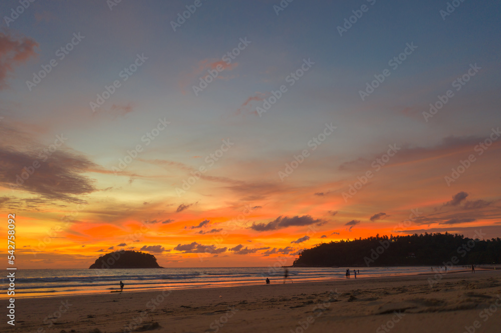Fototapeta premium aerial view sweet sky in sunset above the ocean at Kata beach Phuket. .abstract nature background..Sunset with sweet color light rays and other atmospheric effects.