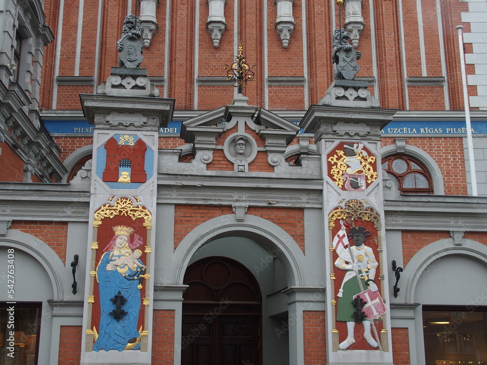 Colorful details on the facade of the House of Blackheads in Riga, Latvia: on the left Mary and the Christ Child, on the right the patron saint St. Maruritius
