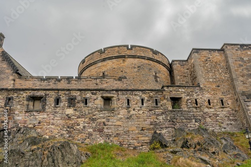 Low anglw shot of the construction of the historic Edinburgh Castle under overcast sky photo