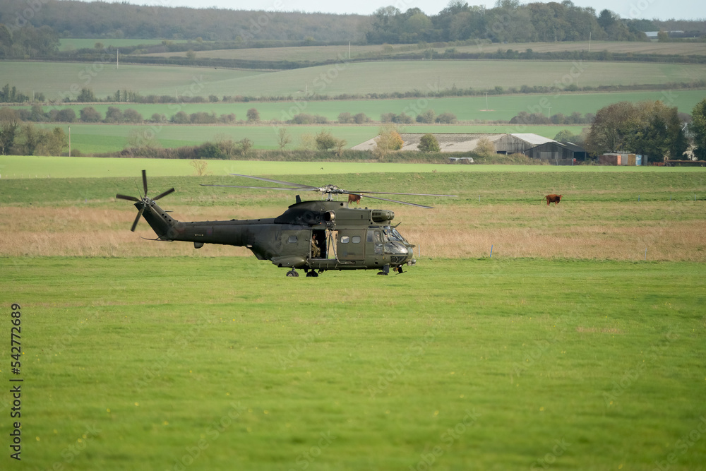 British Royal Air Force Joint Helicopter Command (JHC) Puma HC2 Helicopter preparing to take off on a military exercise, autumn sky, Wiltshire UK British Royal Air Force Joint Helicopter Command (JHC) Puma HC2 Helicopter preparing to take off on a military exercise, autumn sky, Wiltshire UK
