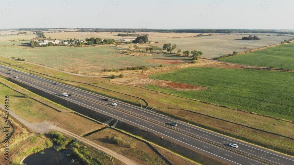 Aerial shot of highway and countryside field, small lake and moving cars, summer, Poland
Aerial shot of highway and countryside field, small lake and moving cars, summer, Poland
