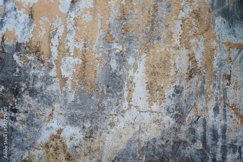 Dark background wall for vintage design. Cracks in the gray concrete surface, cracked old walls