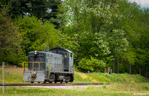 A Lonely Diesel Switcher Traveling Along the Countryside on a Spring Day © Greg Kelton
