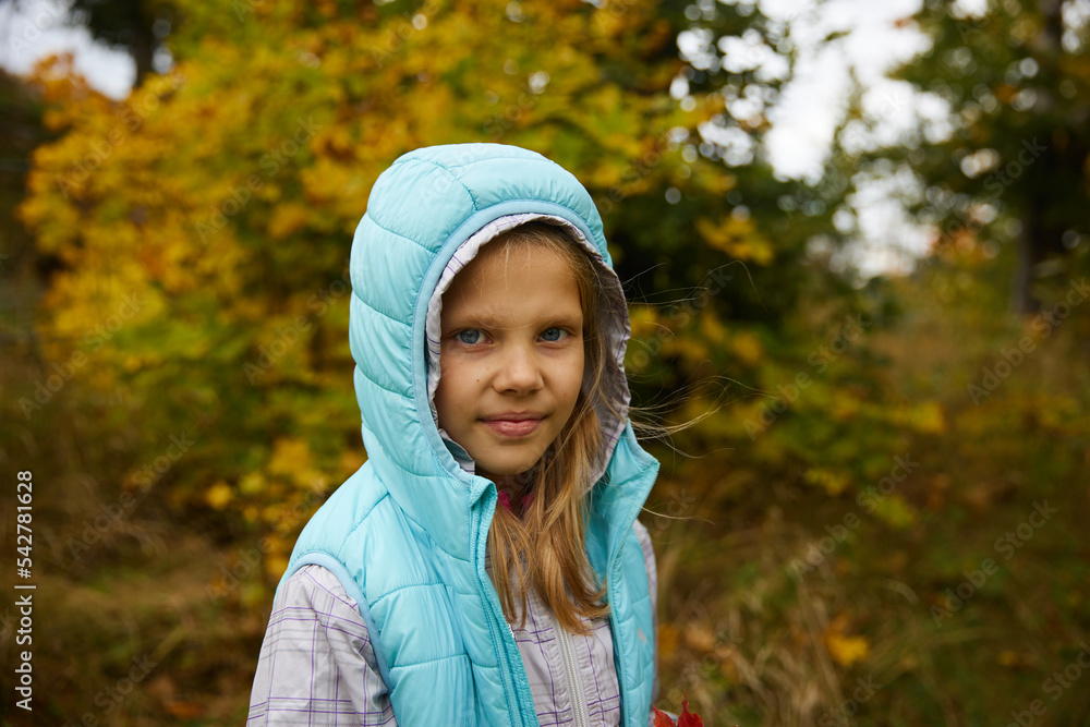 Cute little girl closes her eyes with bright fallen leaves Cute little girl closes her eyes with bright fallen leaves