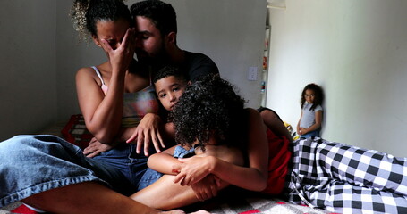 Hispanic family consoling each other during hard times together