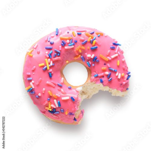 Murais de parede Pink frosted donut with colorful sprinkles with bite missing