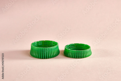 Plastic lids for larger and smaller water bottles. Reducing the use of plastic to save the environment. Environmental protection technologies. Ecology.