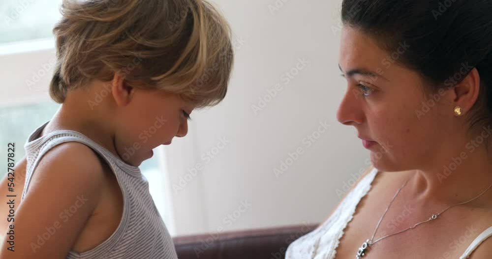 Mother scolding child misbehavior and doing pinky swear. Child promising to behave after scold Mother scolding child misbehavior and doing pinky swear. Child promising to behave after scold