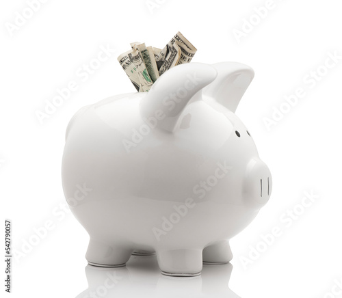 White piggy bank with money isolated on white background