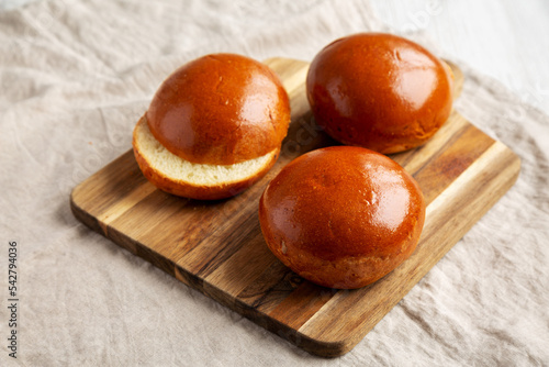 Wallpaper Mural Homemade Brioche Hamburger Buns on a wooden board, side view. Torontodigital.ca