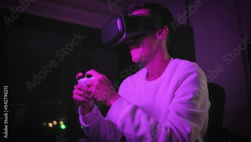 young man excitedly playing console game and winning and happy,indoor video, console games, nerdy life