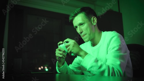 young man excitedly playing console game and winning and happy,indoor video, console games, nerdy life