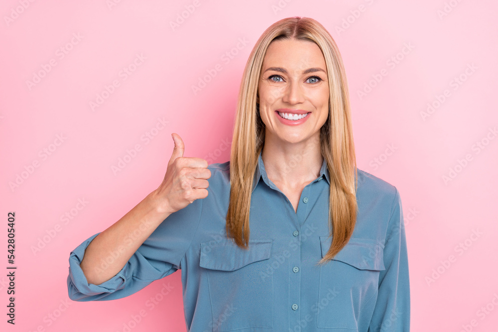 Closeup photo of young positive excited businesswoman manager recommend thumb up like new product promo advert isolated on pink color background Closeup photo of young positive excited businesswoman manager recommend thumb up like new product promo advert isolated on pink color background