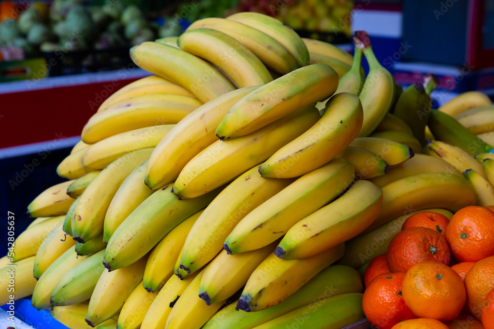 Fresh bananas on counter in food market. High quality photo