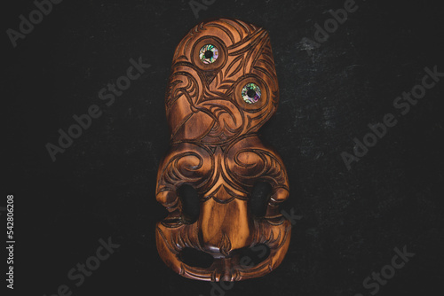 Wooden Maori Hei Tiki hand carved with paua shell eyes. New Zealand taonga.