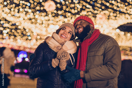 Photo of dreamy cute boyfriend girlfriend dressed winter season outfits looking noel x-mas decorations outdoors urban city street