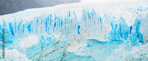 Panorama of rugged glacier cracked edge Perito Moreno (Glaciar Perito Moreno) on sunny summer day. Patagonia, Argentina, Andes