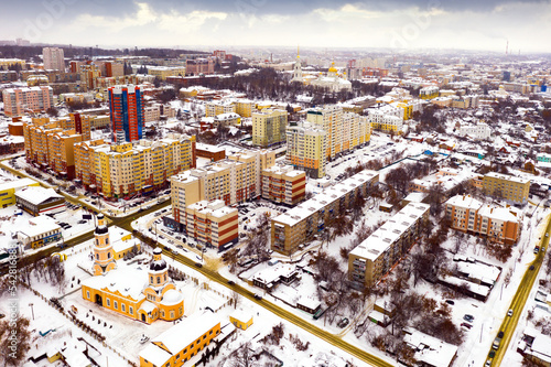 Fotobehang Winter view from a drone of residential areas in the center of Penza and the Intercession Bishop Cathedral, Russia