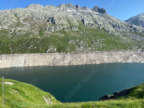 Artificial reservoir lake Lago di Lucendro or accumulation lake Lucendro in the Swiss alpine area of the St. Gotthard Pass (Gotthardpass), Airolo - Canton of Ticino (Tessin), Switzerland (Schweiz) photo