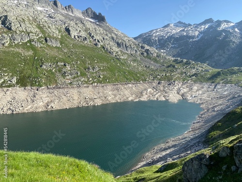 Fototapeta Naklejka Na Ścianę i Meble -  Artificial reservoir lake Lago di Lucendro or accumulation lake Lucendro in the Swiss alpine area of the St. Gotthard Pass (Gotthardpass), Airolo - Canton of Ticino (Tessin), Switzerland (Schweiz)