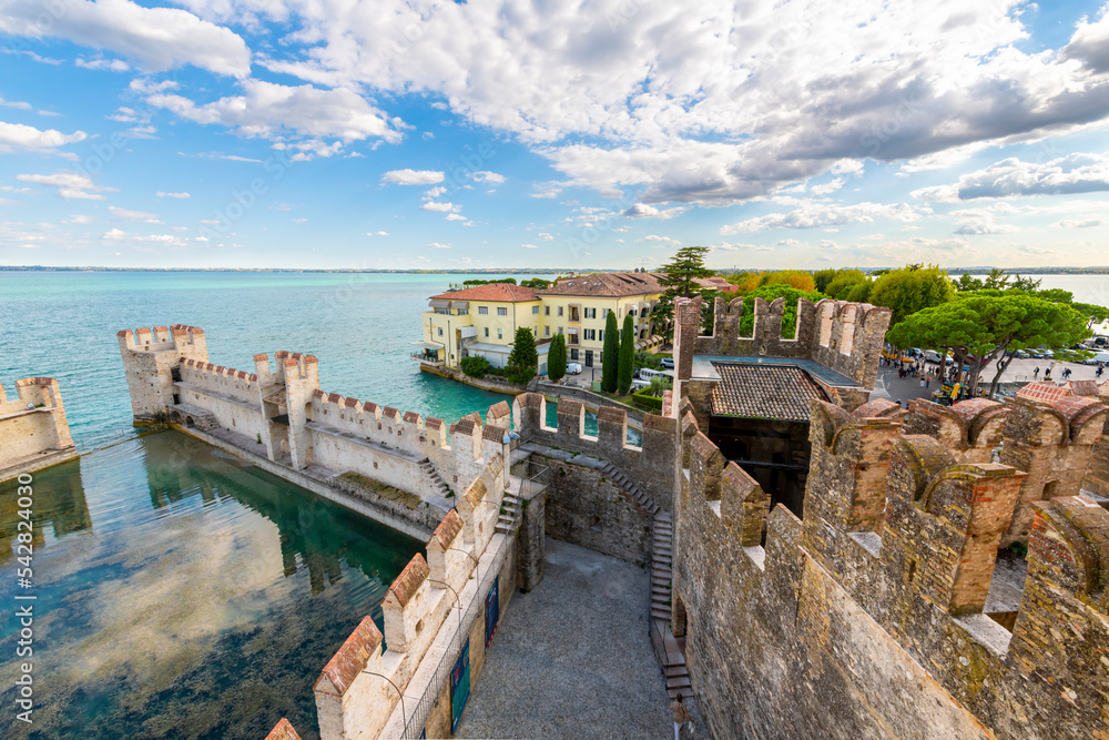 View of the medieval old town and Lake Garda from the Scaligero Castle in the Italian resort town of Sirmione, Italy.	