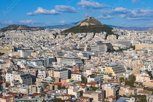 Athens, Attica, beautiful super-wide angle view of Athens city, Greece, Mount Lycabettus, mountains and scenery beyond the city, seen from The Parthenon, temple on the Athenian Acropolis © tsuguliev
