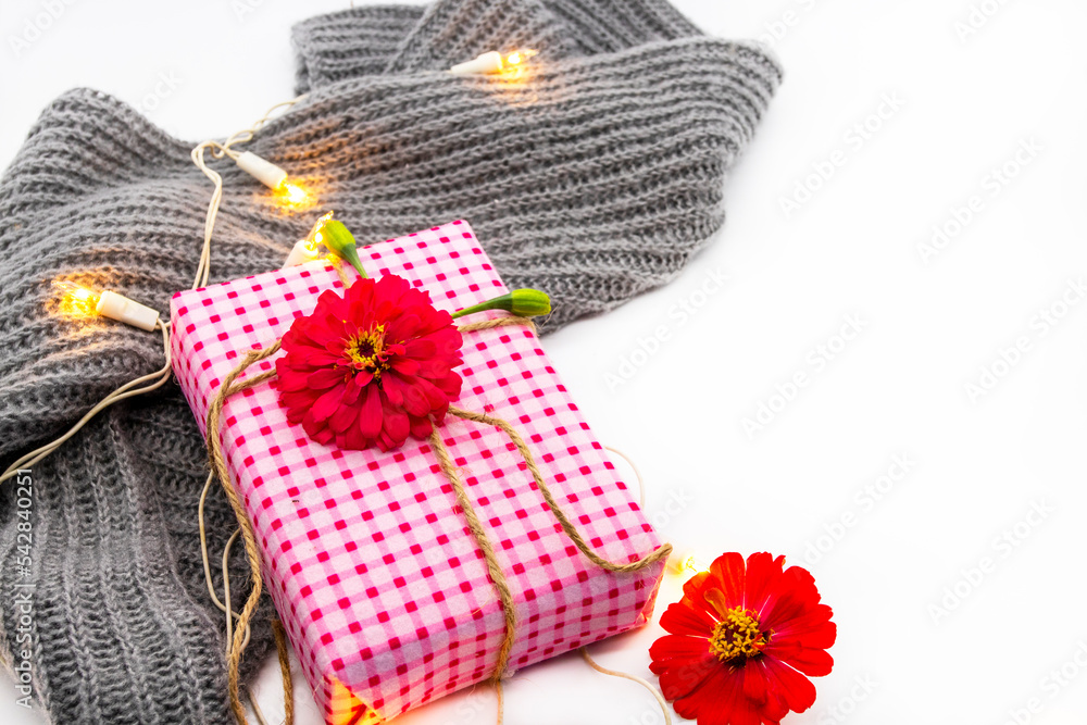 gift box for special in christmas and new year festival day with knitting scarf arrangement flat lay postcard style on background white