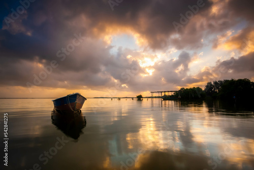 Long Boat near the beach of Tumpat Kelantan, moment during sunrise. photo