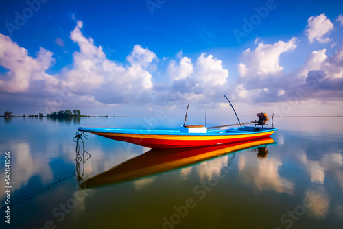 Long Boat near the beach of Tumpat Kelantan, moment during sunrise. photo