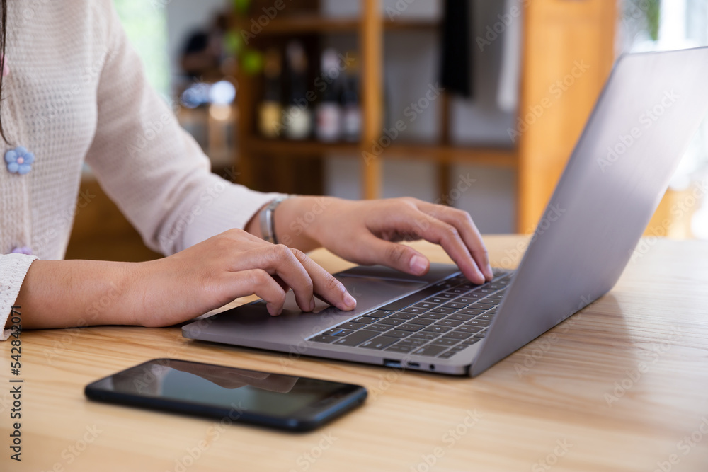 Businesswoman working on a laptop computer in home office, Work from home. Businesswoman working on a laptop computer in home office, Work from home.