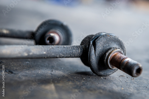 Slika na platnu Close-up of worn out ,broken car front stabilizer sway bar link.