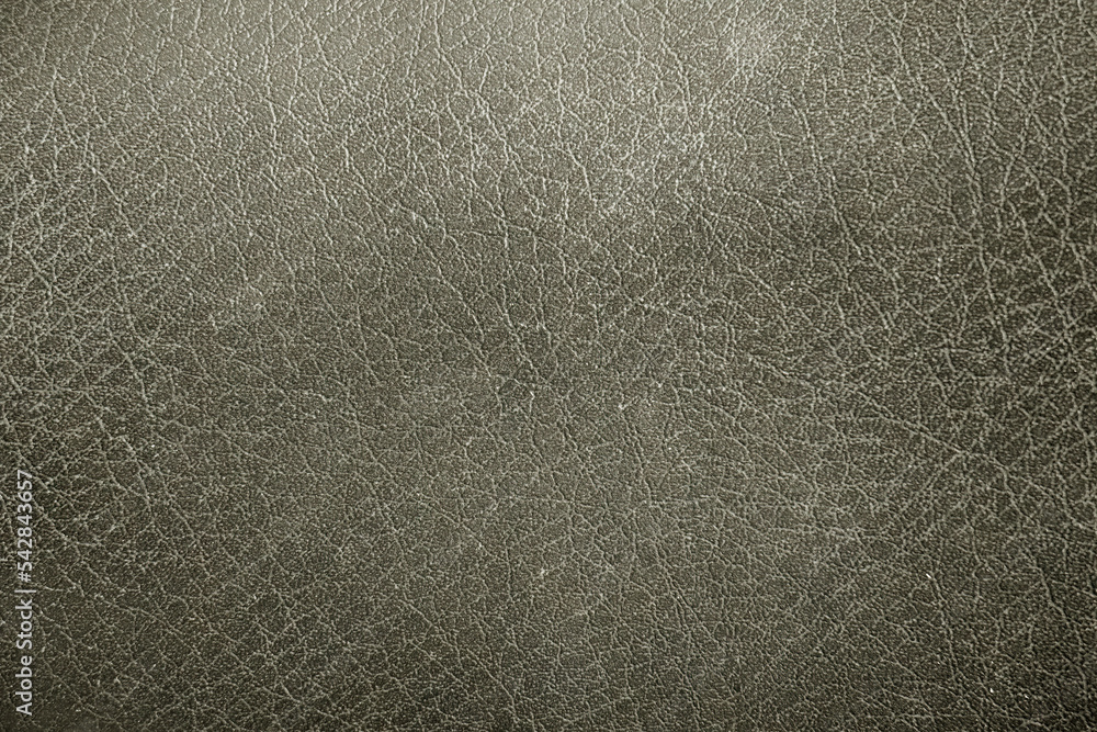 Fototapeta premium Close-up of luxurious leather texture. Detailed close-up of premium leather fabric. Soft leather texture for design purposes. Textured leather surface with subtle detailing