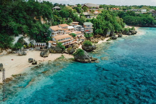 Aerial view of ocean and coastline with hotels on Impossibles beach in Bali