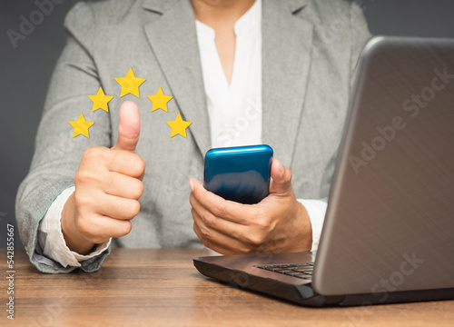 Businesswoman hand with thumb up for best excellent services satisfaction client giving a five-star rating