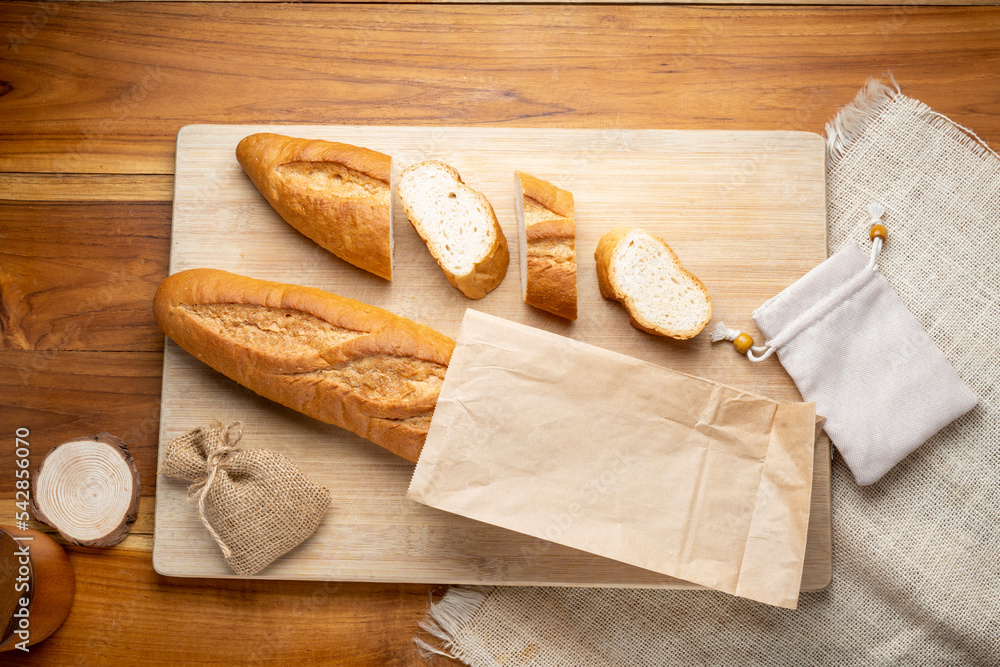 Baked baguette and multigrain loaf bread in Paper bag ready to serve