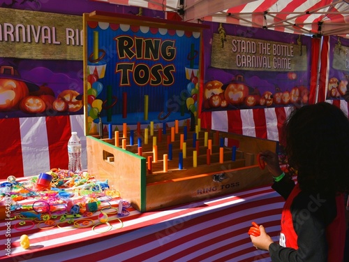 Child Playing Carnival Game, Ring Toss