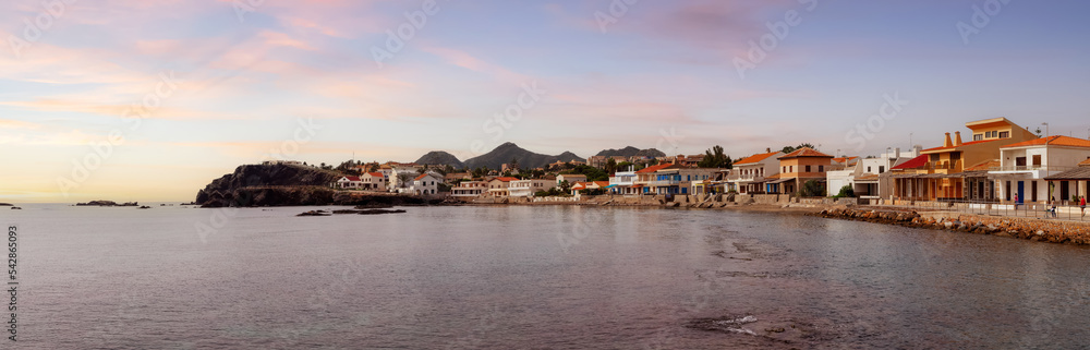 Homes in a touristic Spanish Town by the Mediterranean Sea. Cloudy Sunrise Sky Art Render. Cape Palos, Spain. Panorama