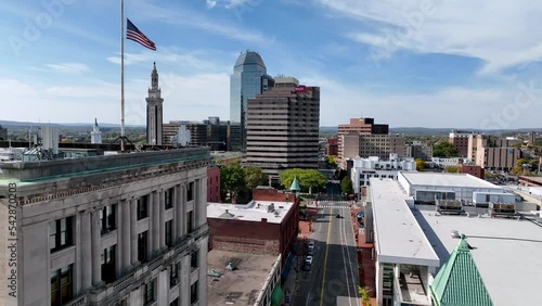 aerial push past american flag atop building in springfield massachusetts