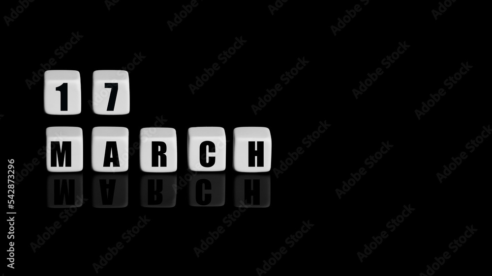 March 17th. Day 17 of month, Calendar date. White cubes with text on black background with reflection.Spring month, day of year concept March 17th. Day 17 of month, Calendar date. White cubes with text on black background with reflection.Spring month, day of year concept