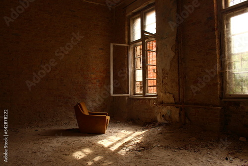 Lost place, old House, abandoned chair in front of a window