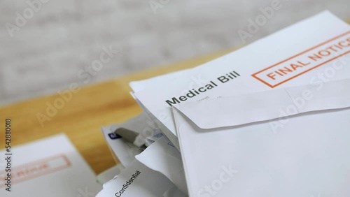 Close up of a pile of bills and letters with a medical bill final notice for healthcare