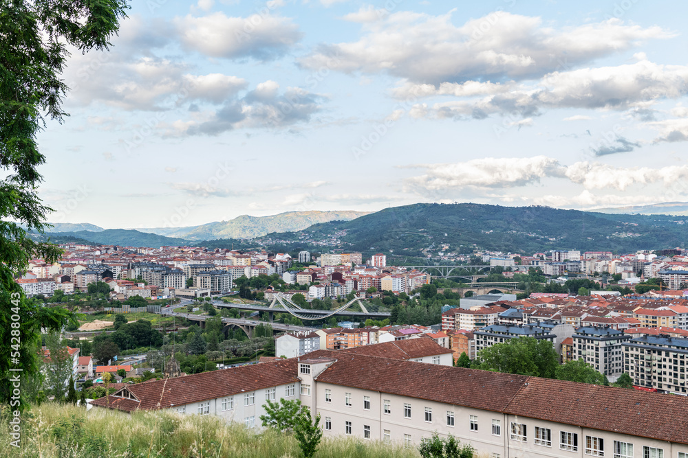 Panorama view of the skyline of the Galician city of Ourense as seen from the outskirts, with the three main bridges to be recognized.